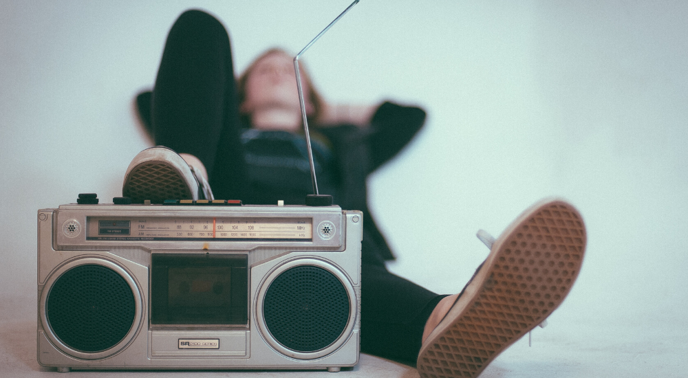 Girl laying and listening to music